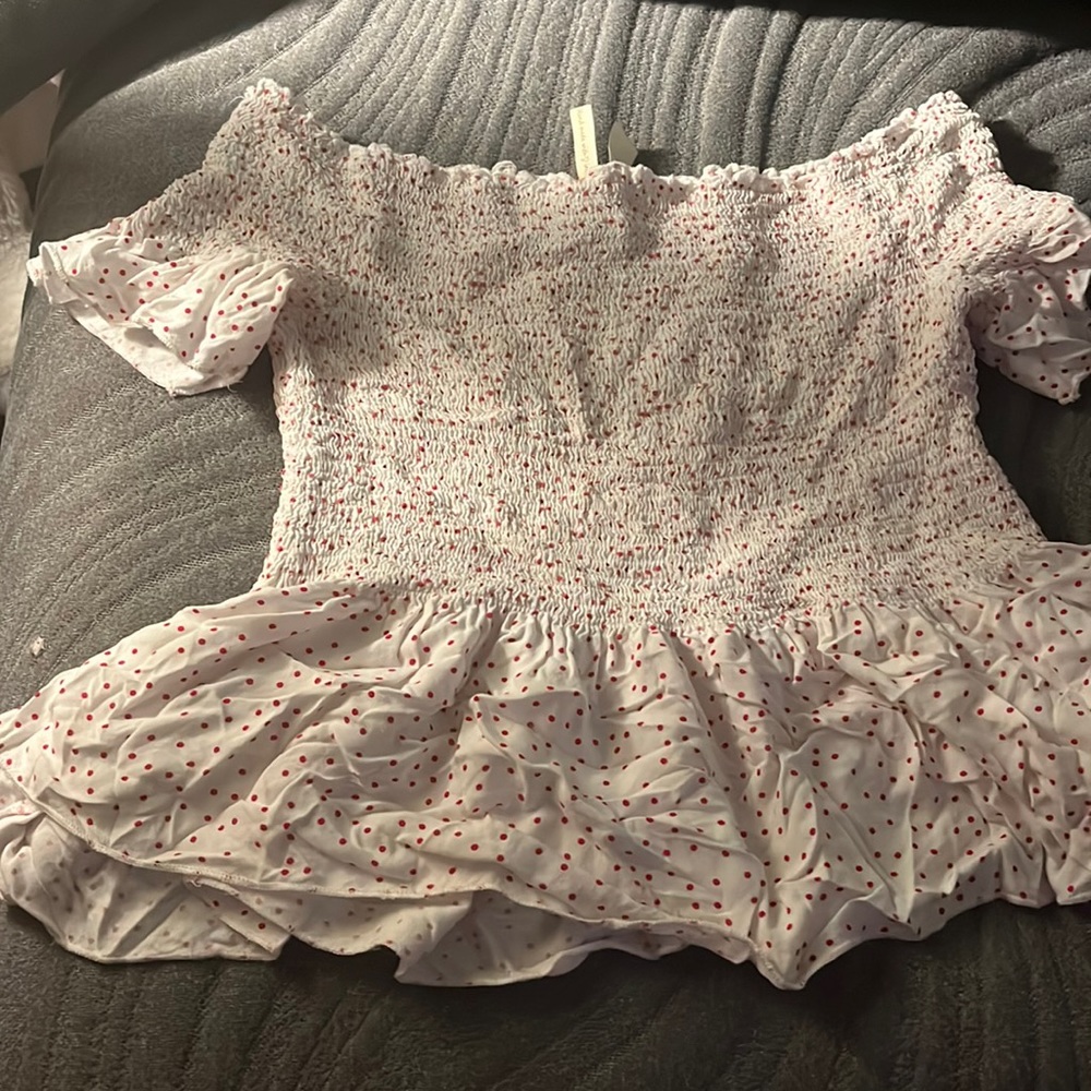 White top with red dots, been worn, in great condition